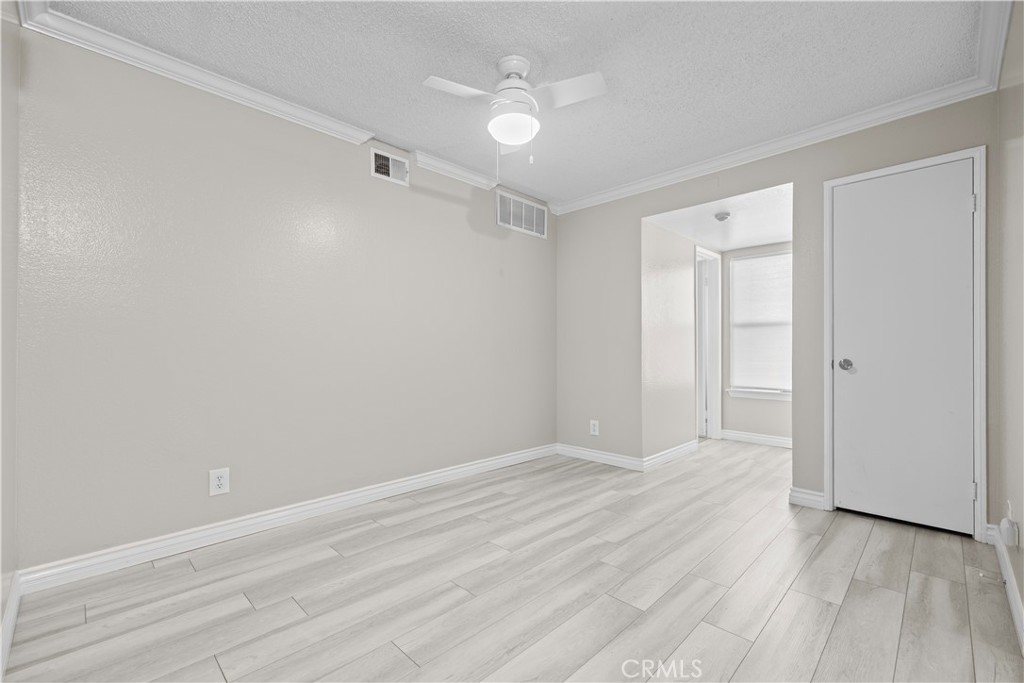 10655 Lemon Avenue, Unit 2703 Rancho Cucamonga, CA 91737 - Photo 6 of 31 wooden floor in an empty room with a window