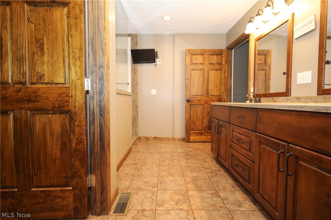 38610 Spiedel Town Road Bethesda, OH 43719 - Photo 25 of 33 Bathroom with vanity and tile patterned flooring