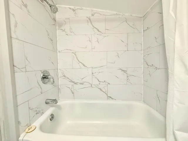 a bathroom with a bathtub