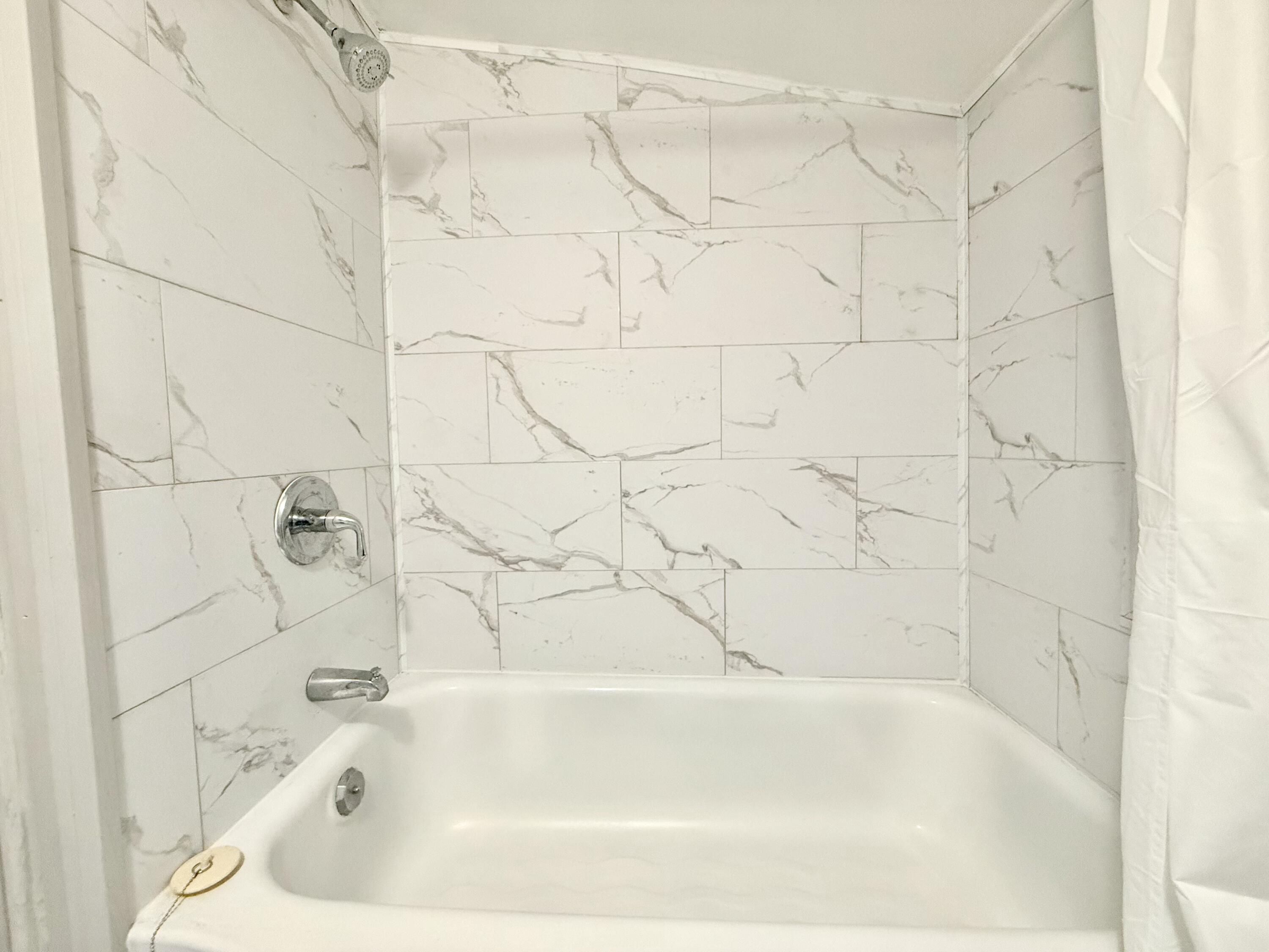 3715 Sandlewood Road Roanoke, VA 24018 - Photo 13 of 15 a bathroom with a bathtub