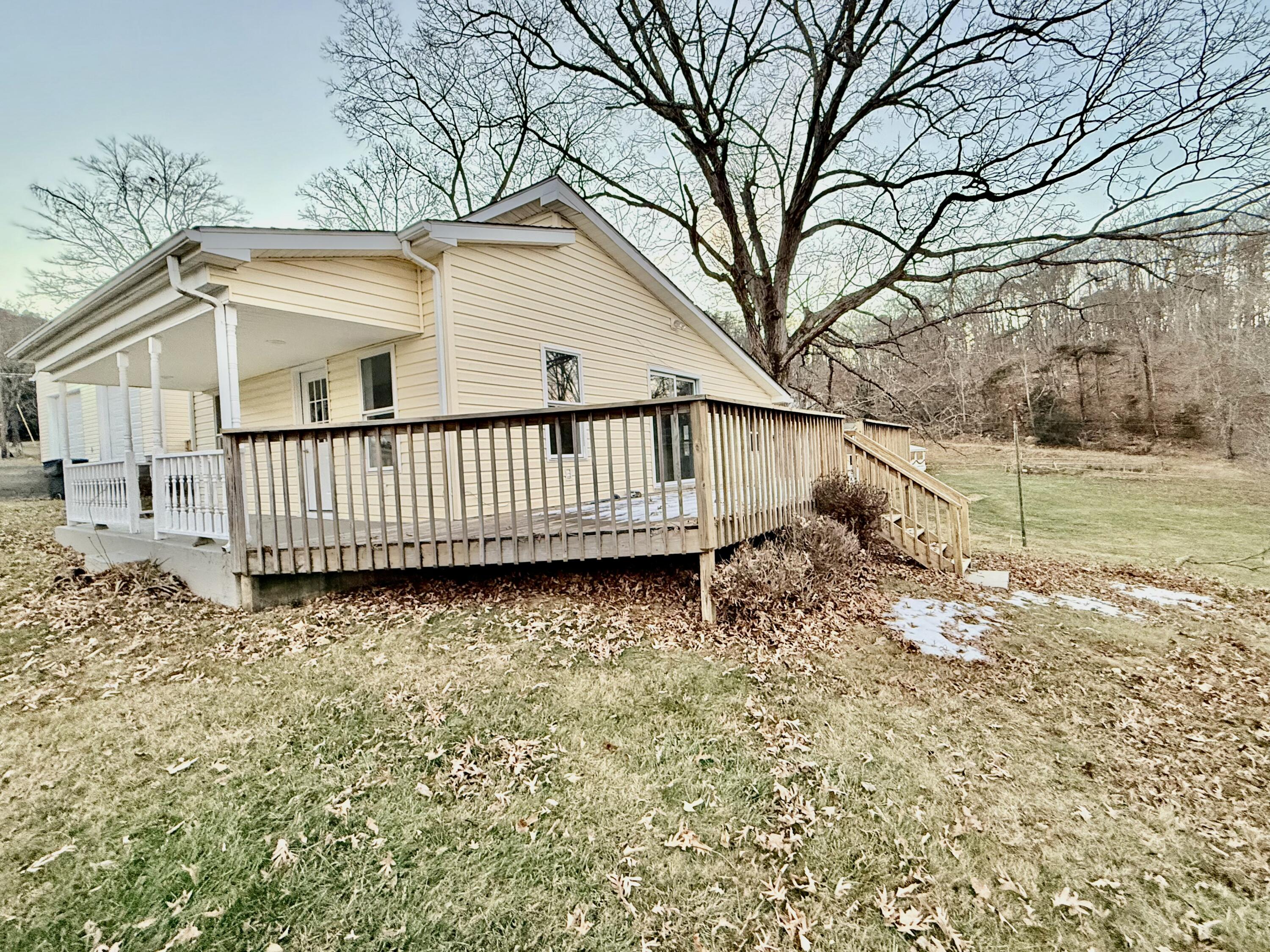 3715 Sandlewood Road Roanoke, VA 24018 - Photo 15 of 15 a view of a yard with plants and wooden fence