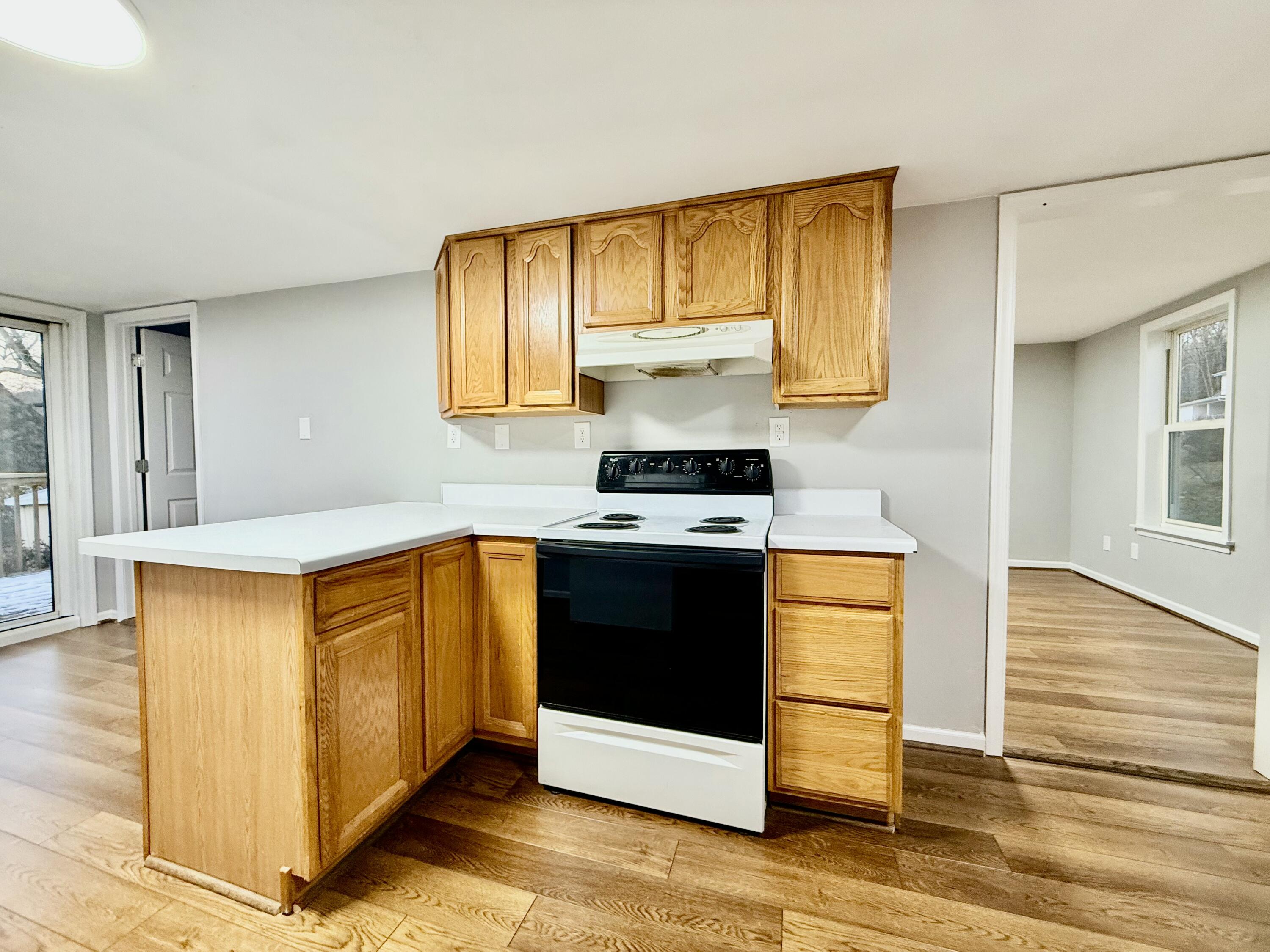 3715 Sandlewood Road Roanoke, VA 24018 - Photo 5 of 15 a kitchen with stainless steel appliances granite countertop a stove a sink and a microwave