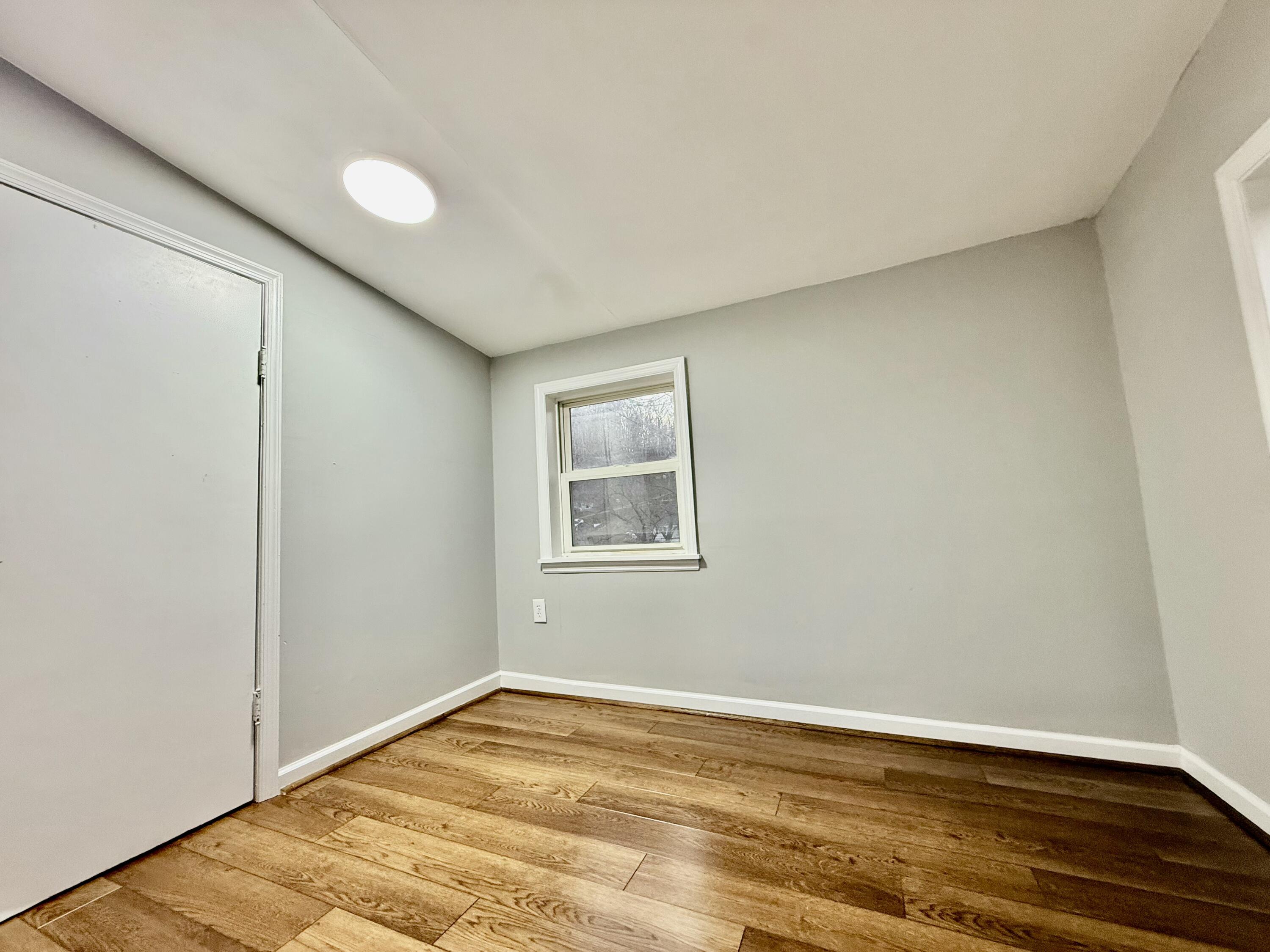 3715 Sandlewood Road Roanoke, VA 24018 - Photo 9 of 15 a view of an empty room and wooden floor