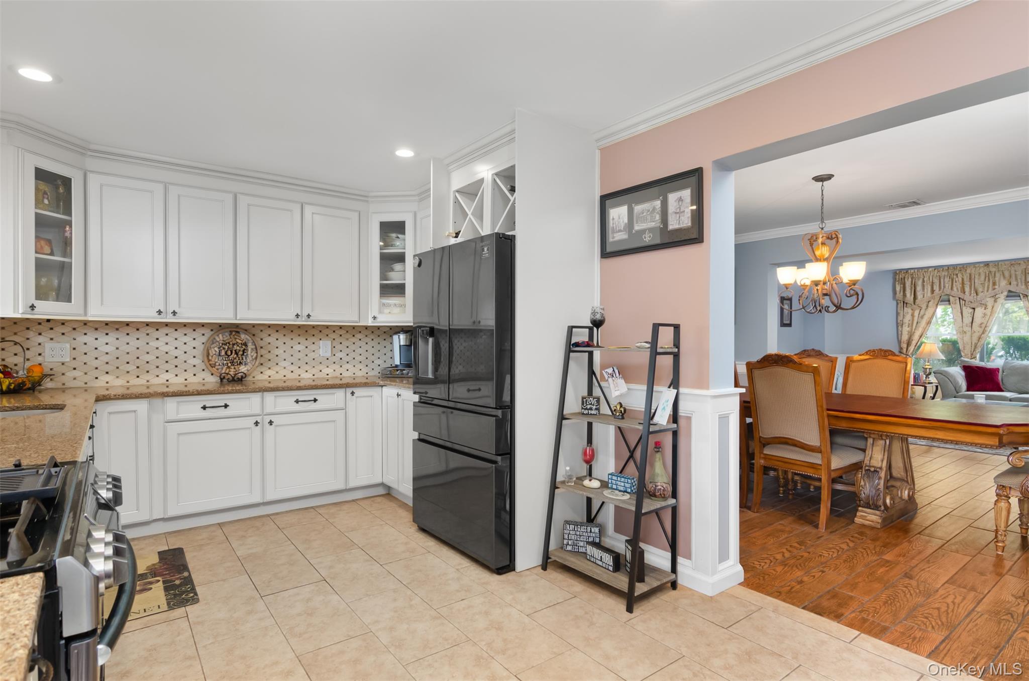 18 Calico Tree Lane Coram, NY 11727 - Photo 11 of 35 a kitchen with refrigerator and cabinets