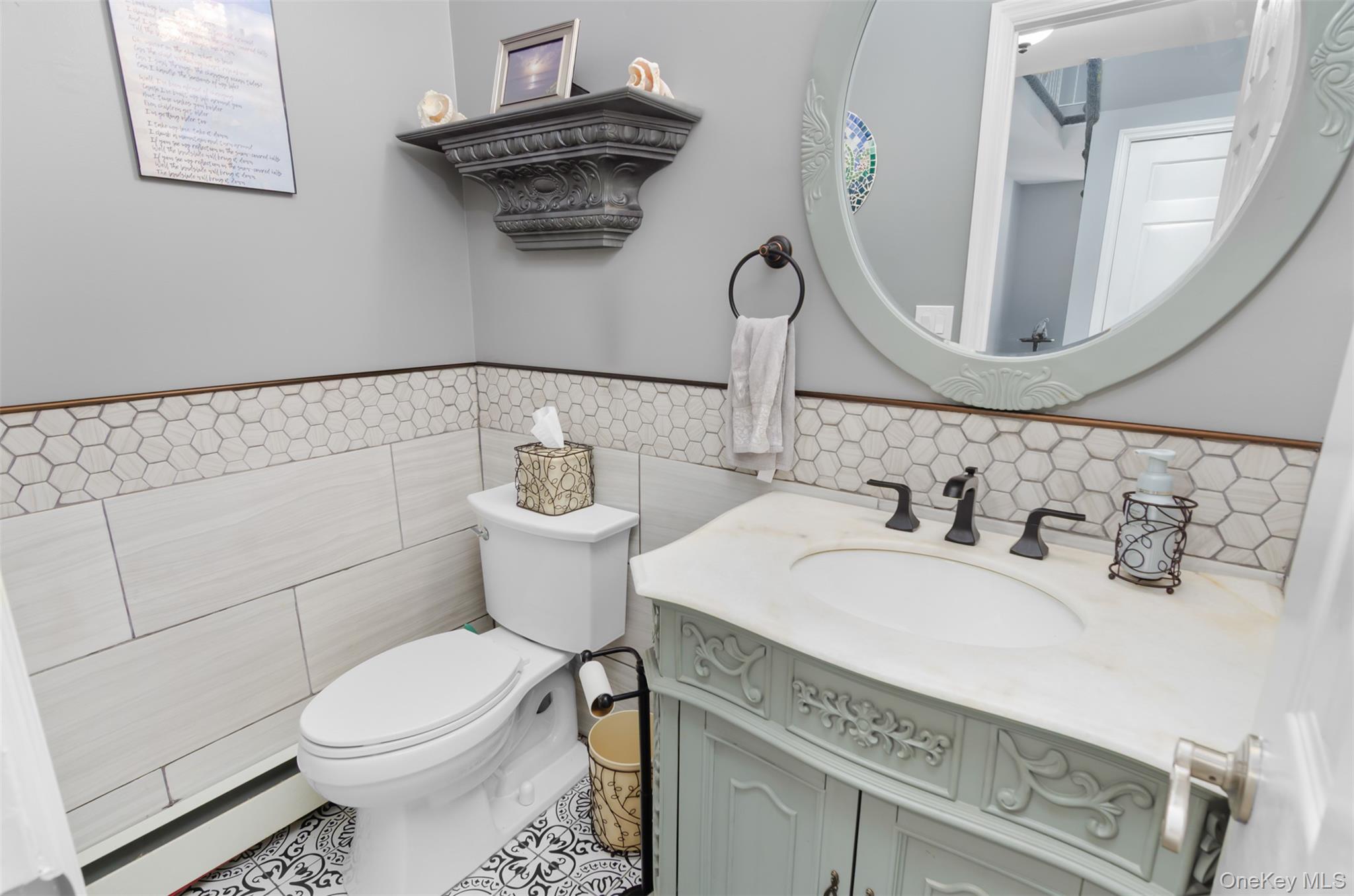 18 Calico Tree Lane Coram, NY 11727 - Photo 14 of 35 a bathroom with a granite countertop toilet sink and mirror