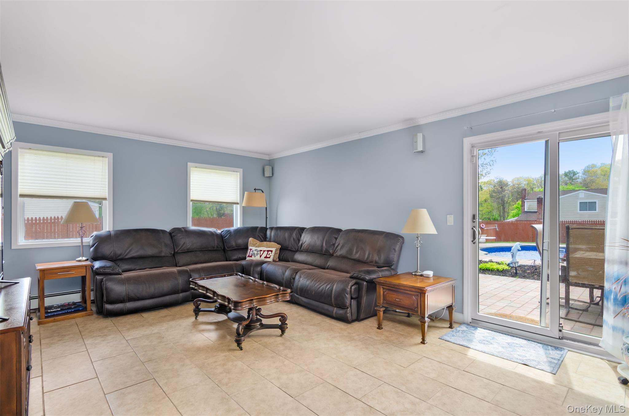 18 Calico Tree Lane Coram, NY 11727 - Photo 16 of 35 a living room with furniture and a couch