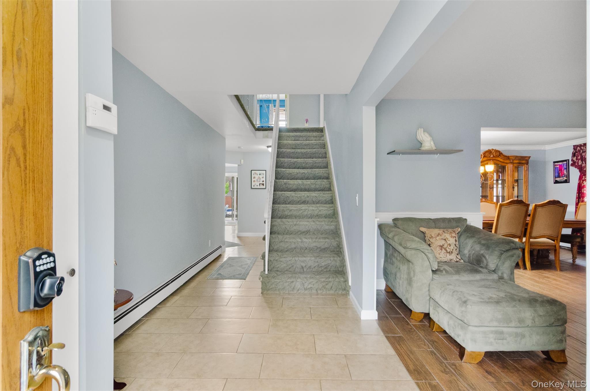 18 Calico Tree Lane Coram, NY 11727 - Photo 3 of 35 a view of entryway and hall with wooden floor