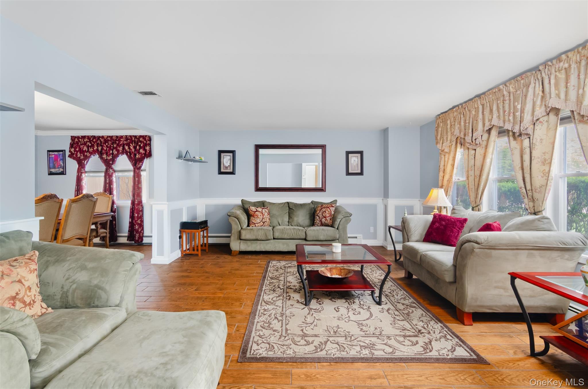 18 Calico Tree Lane Coram, NY 11727 - Photo 5 of 35 a living room with furniture and a rug