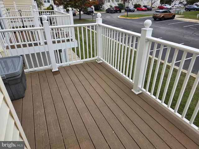 a view of a balcony with car parked