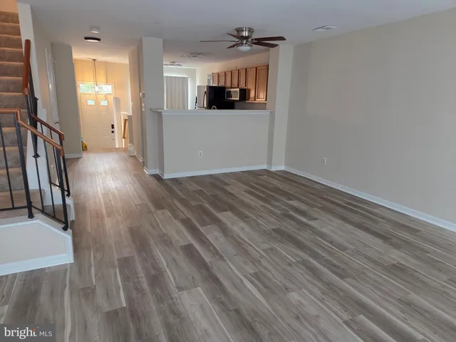 a view of a livingroom with wooden floor