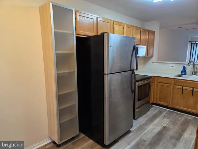 a white refrigerator freezer sitting in a kitchen