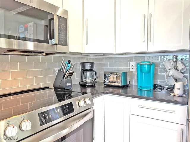 a kitchen with a stove and a microwave