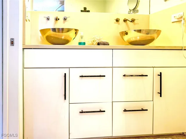 a bathroom with a tub and a sink