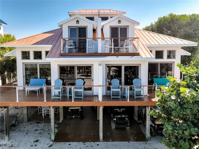 a front view of a building with dining table and chairs