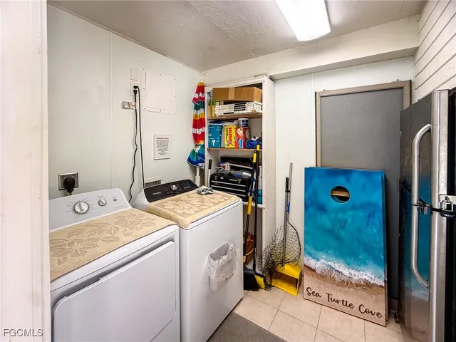 a view of a patio with table and chairs