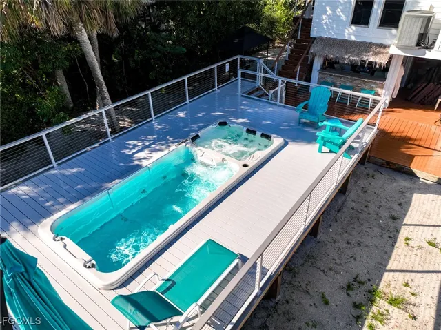 a view of a backyard with sitting area