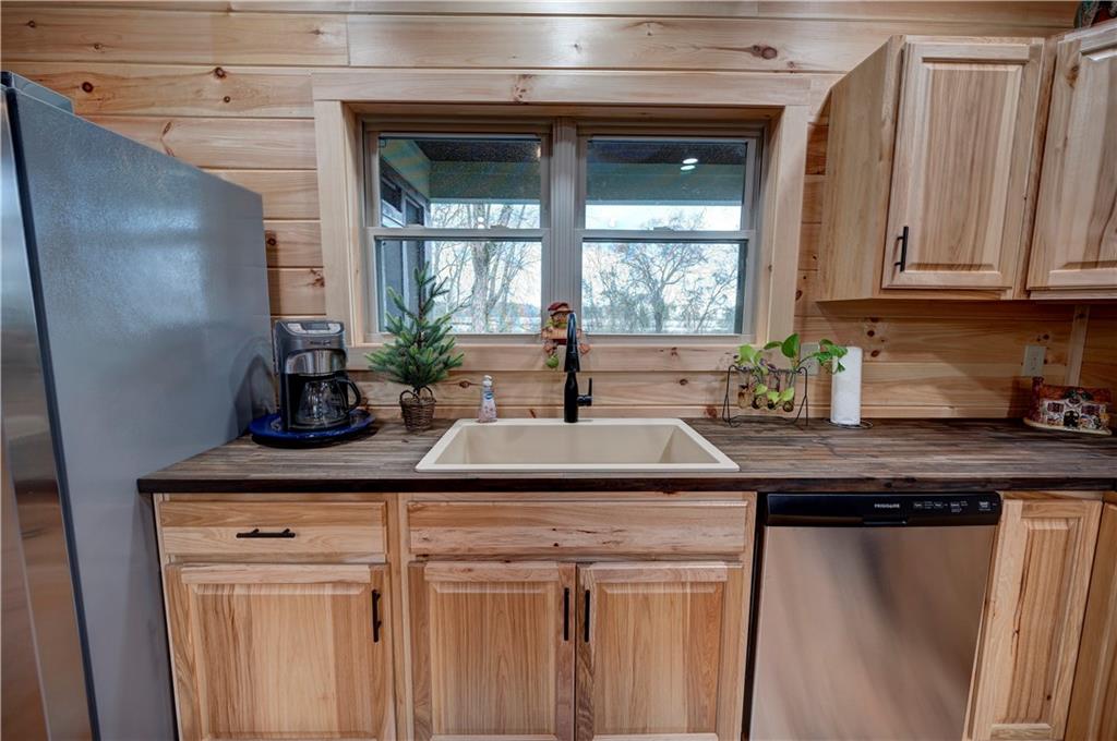 2092 Pleasant Hill Road Northeast Ranger, GA 30734 - Photo 13 of 87 a kitchen with stainless steel appliances granite countertop a sink a counter space and cabinets