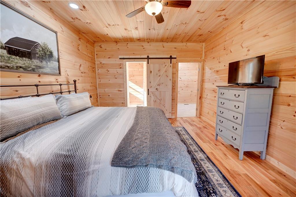 2092 Pleasant Hill Road Northeast Ranger, GA 30734 - Photo 19 of 87 a bedroom with a bed and flat screen tv