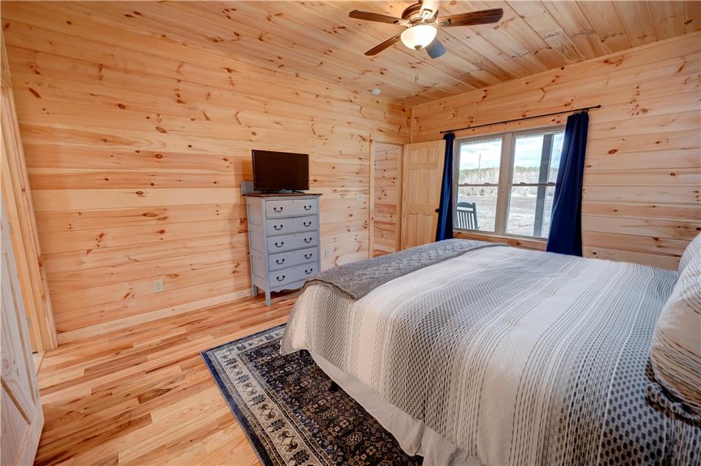 2092 Pleasant Hill Road Northeast Ranger, GA 30734 - Photo 21 of 87 a bedroom with a bed and a flat screen tv
