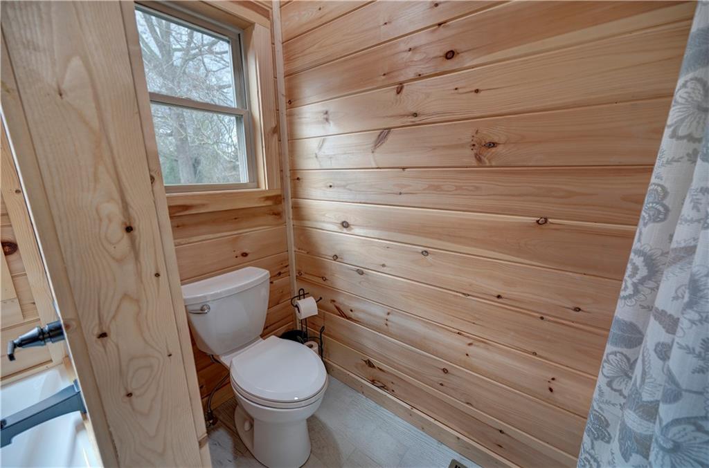 2092 Pleasant Hill Road Northeast Ranger, GA 30734 - Photo 27 of 88 a bathroom with a toilet and a sink
