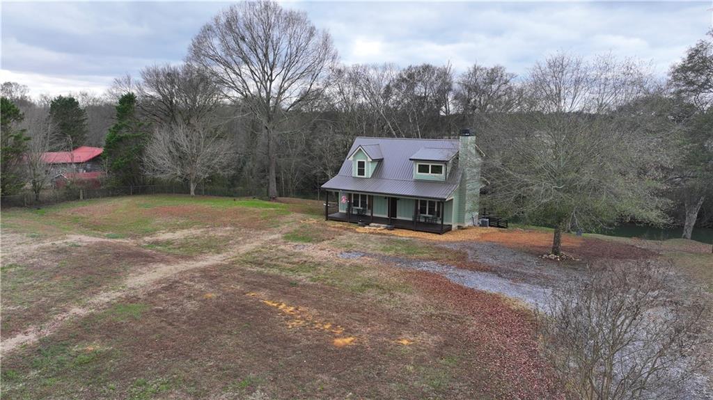 2092 Pleasant Hill Road Northeast Ranger, GA 30734 - Photo 3 of 88 a house with tall trees in the background