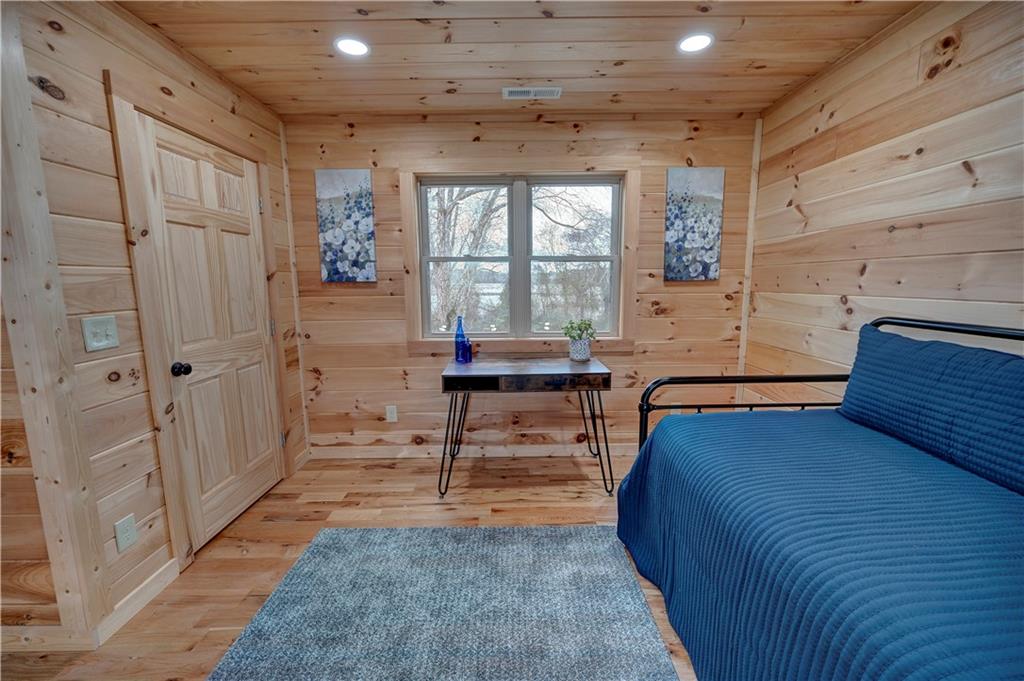 2092 Pleasant Hill Road Northeast Ranger, GA 30734 - Photo 33 of 88 a bedroom with a bed and a table