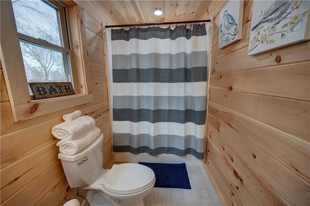 2092 Pleasant Hill Road Northeast Ranger, GA 30734 - Photo 36 of 88 a white toilet sitting next to a bathroom sink