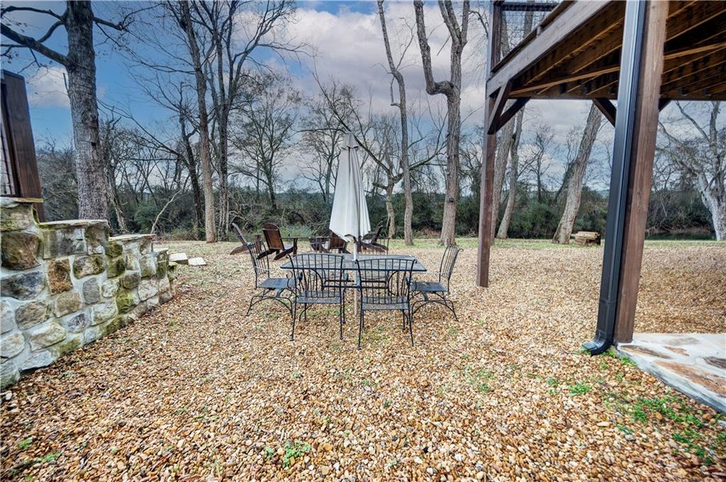 2092 Pleasant Hill Road Northeast Ranger, GA 30734 - Photo 49 of 87 a view of a chairs and tables in the patio