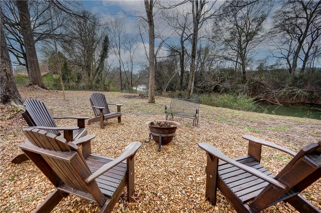 2092 Pleasant Hill Road Northeast Ranger, GA 30734 - Photo 52 of 88 a view of a patio with chairs and a table
