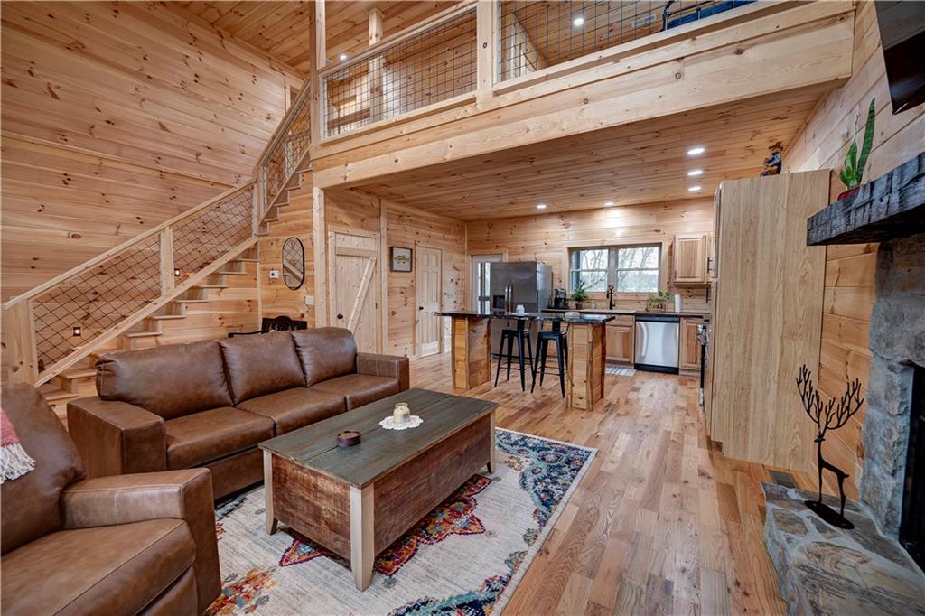 2092 Pleasant Hill Road Northeast Ranger, GA 30734 - Photo 8 of 87 a living room with furniture and a wooden floor