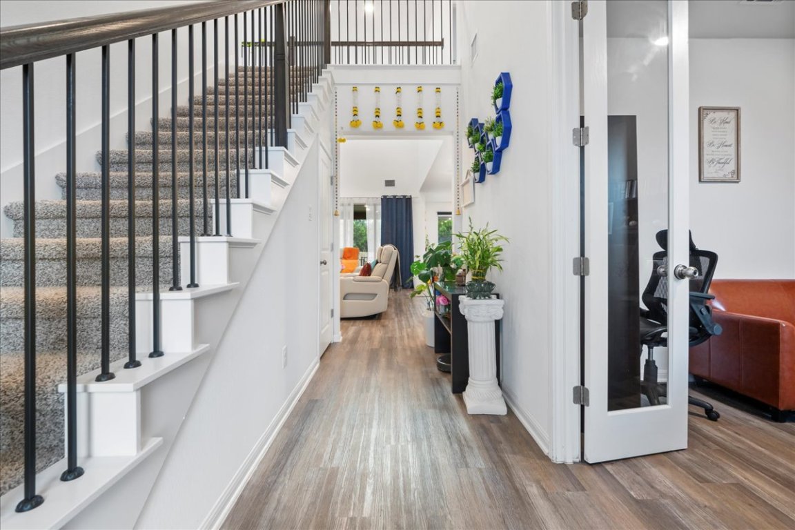 209 Terra Mnr Trail Georgetown, TX 78628 - Photo 11 of 40 Foyer entrance with stairs and wood finished floors