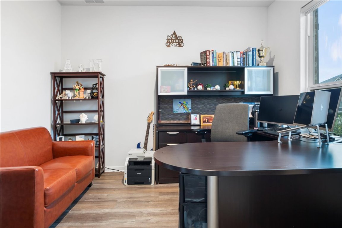 209 Terra Mnr Trail Georgetown, TX 78628 - Photo 21 of 40 Office area with light wood finished floors and healthy amount of natural light