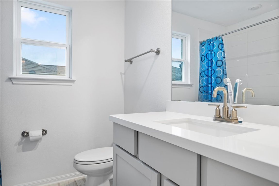 209 Terra Mnr Trail Georgetown, TX 78628 - Photo 23 of 40 Bathroom featuring vanity and a shower with shower curtain