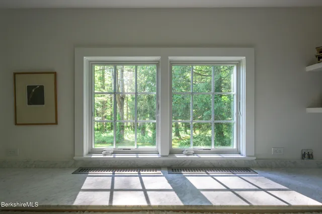 a view of a room that has a window and outside view