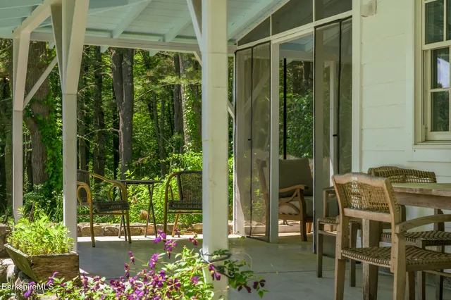 a view of a chairs and table in the patio