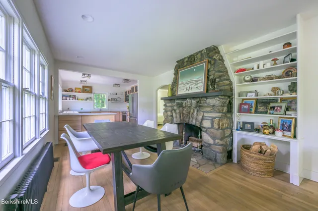 a dining room with furniture and a fireplace