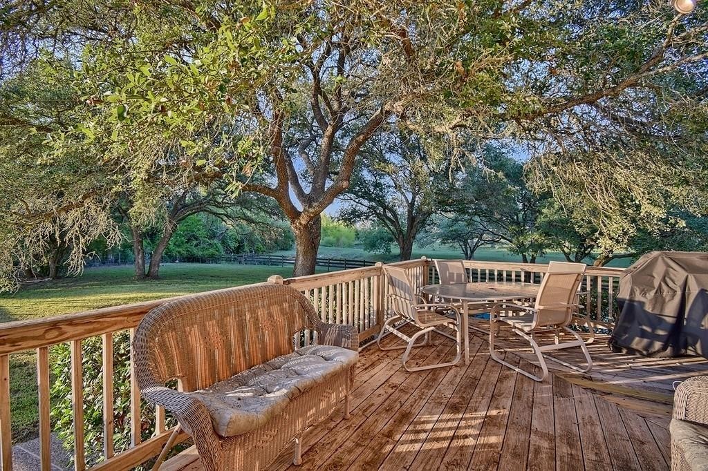 8456 Schuster Road Ledbetter, TX 78946 - Photo 34 of 49 a view of balcony with wooden floor and fence