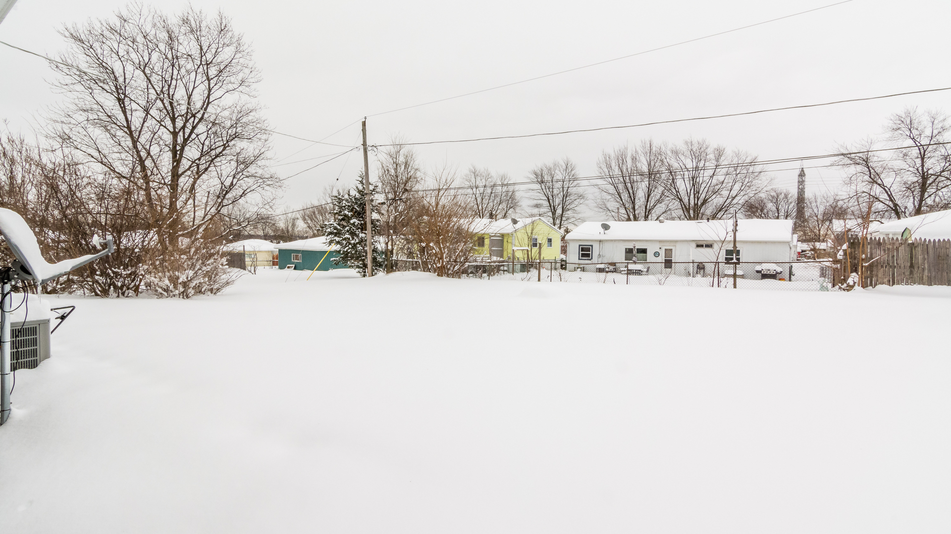313 Healy Avenue Romeoville, IL 60446 - Photo 3 of 24 a view of a covered with snow