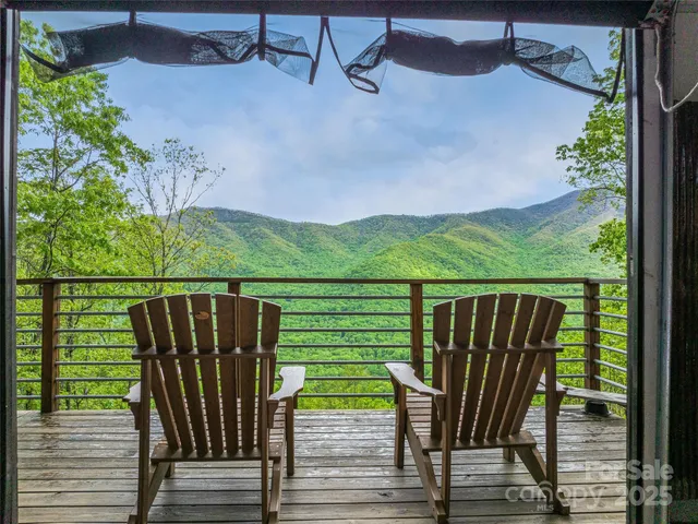 swimming view from balcony with outdoor seating