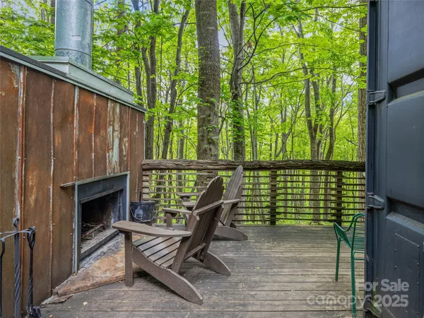 a view of a two chairs in the balcony