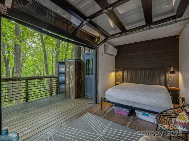 a view of balcony with wooden floor and outdoor seating