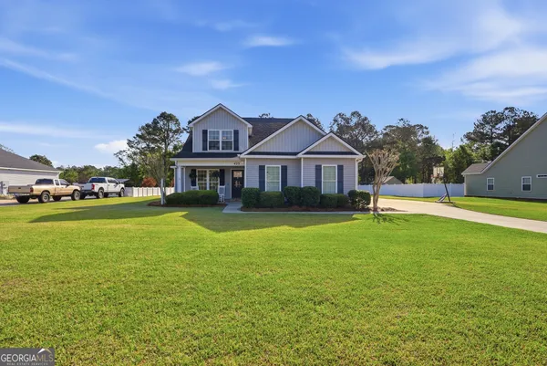 a front view of a house with a yard