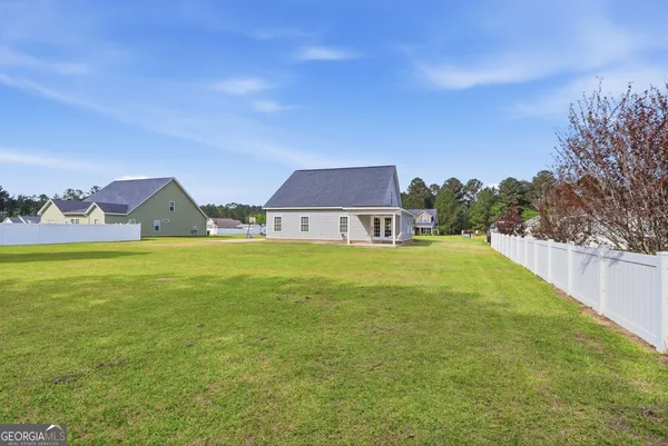 a front view of house with garden