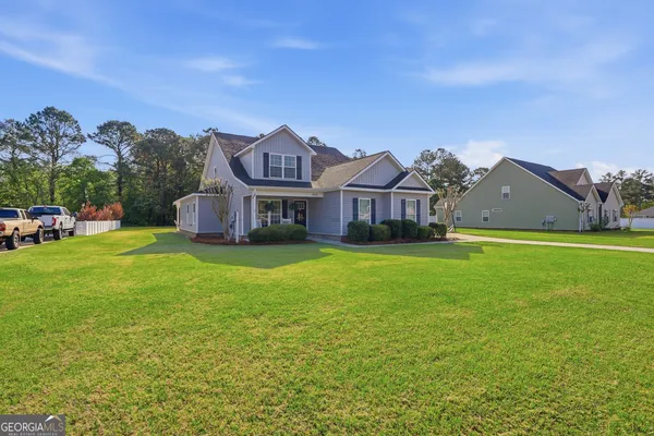 a front view of a house with garden