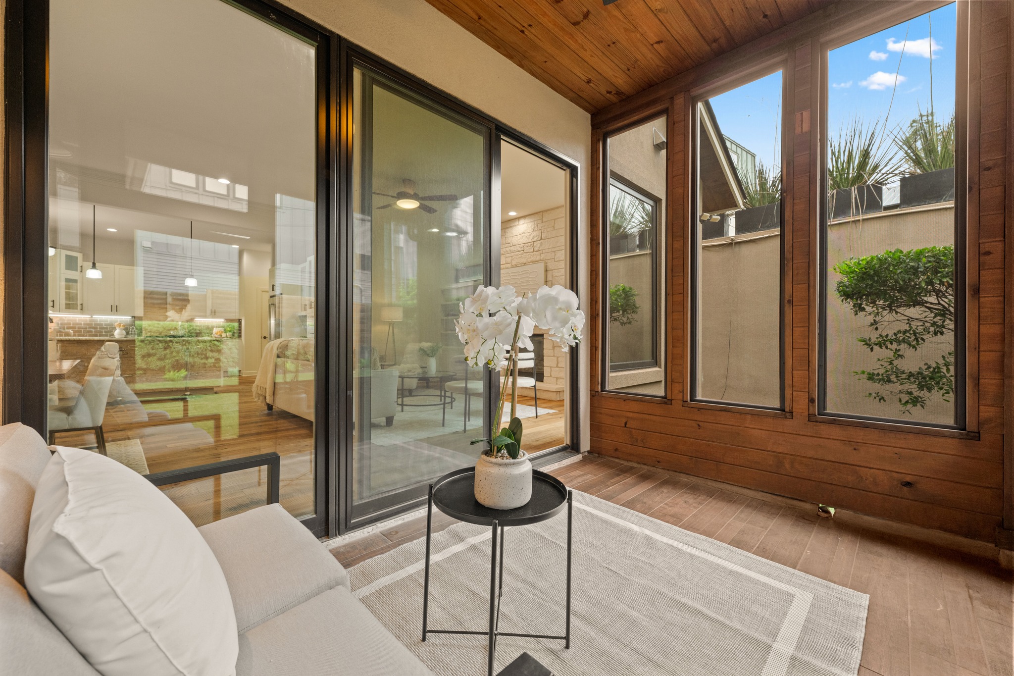 3907 Bailey Lane Austin, TX 78756 - Photo 30 of 40 Enjoy year-round versatility in this bright, enclosed patio, offering a serene, weather-protected retreat that perfectly bridges the gap between indoor comfort and outdoor living