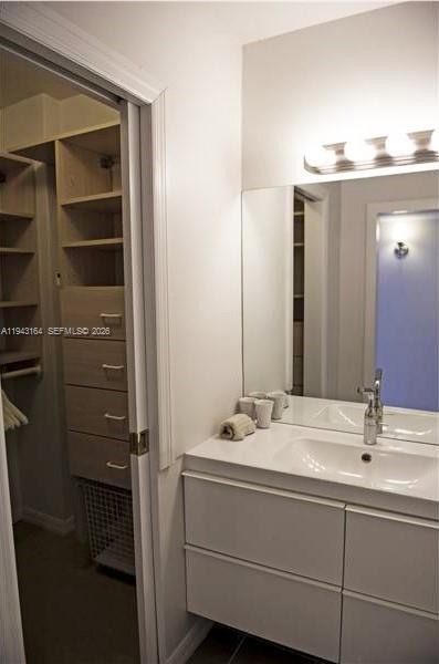 100 Lincoln Road, Unit 1440 Miami Beach, FL 33139 - Photo 12 of 27 a bathroom with a sink vanity and a mirror