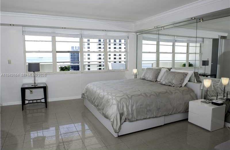 100 Lincoln Road, Unit 1440 Miami Beach, FL 33139 - Photo 7 of 27 a spacious bedroom with a bed and a window