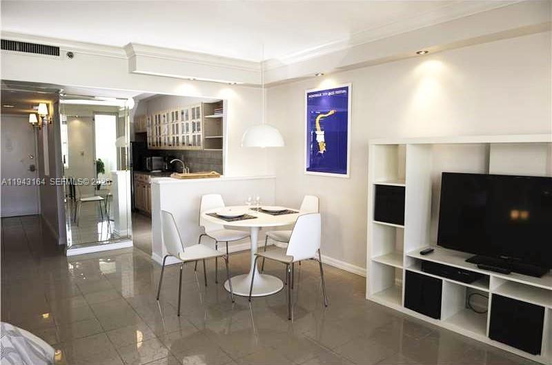 100 Lincoln Road, Unit 1440 Miami Beach, FL 33139 - Photo 8 of 27 a view of a dining room with furniture