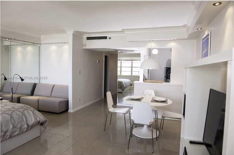 100 Lincoln Road, Unit 1440 Miami Beach, FL 33139 - Photo 9 of 27 a living room with furniture and a flat screen tv