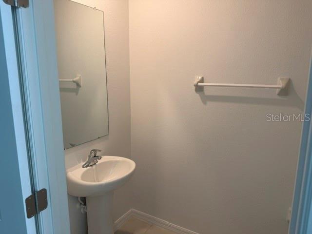 6259 Back Forty Loop Zephyrhills, FL 33541 - Photo 5 of 22 a bathroom with a sink and mirror
